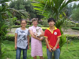 Little Flower and I with my  students, who gave me the traditional dress I am wearing.  Happy memories!