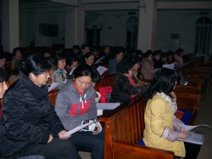 Getting down to business, our choir of 40 gets ready to sing.