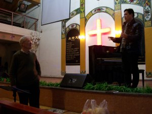 During rehearsals, Robin and John confer.
