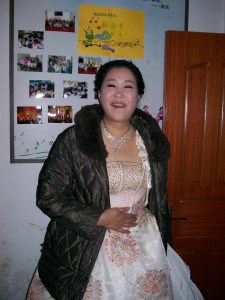 One of our emcees (She'll lose the coat before appearing to the audience.)