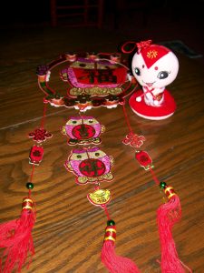 This "fu" (happiness) dangly is now hanging in my home in Marshall.