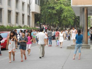 Students from the dormitories await the "all clear" sign after fleeing outside.