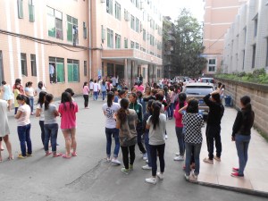 Huddling in groups, students comfort one another.