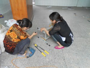 Our women workers, assembling the chairs.