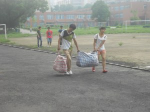 Upper classmen drag  their stored belongings back to the dormitories, with a little help from friends.