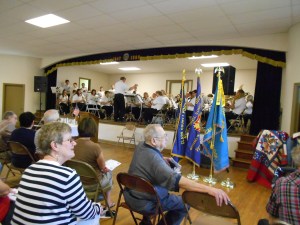 The Marshall City Band plays throughout the service, both festive marches and more solemn numbers.