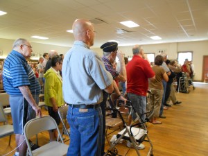 Those in the military, or who have been in the military, will give the military salute.  (Notice our WW 2 vet in the front row is doing this.)