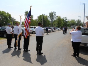 Taps (a sleepy, somber melody) is played by a trumpeter and echoed by another trumpeter in honor of the dead.