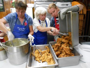 The men in the kitchen were busy frying up batches of catfish and chicken for the crowd, along with mashed potatoes.