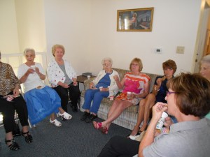 Fellowship time after the service includes lots of coffee and cookies.  Gals to the left of the room . . . 