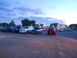 At 8:30 p.m., the high school parking lot begins to fill with those waiting for our 9:15 show to begin