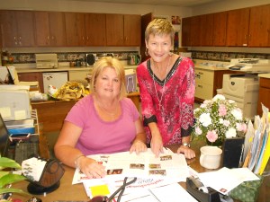 Kelley Ray (seated) and me going over the last touches of my summer newsletter in the church office.