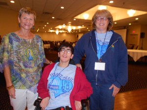 At Mission U, Janine and her caregiver pose for pictures with me after my presentation for those in the weekend session.  (Springfield Northfield Inn conference center)