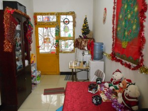 5 boxes of Christmas things, evenly distributed among 3 rooms.