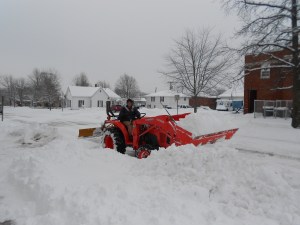 Our church men, out early to plow out car-parking for those who dared drive to worship.