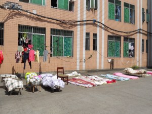 Students wash clothes and sheets by hand in small basins.  There are no dryers in China so  our 90 degree weather, while miserably hot, does have a plus side -- makes for a quick dry!