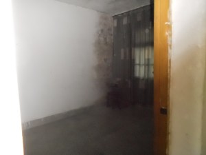 This was their bedroom, dark and dank.