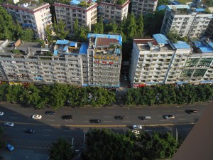 Peering down from my balcony on the street below.